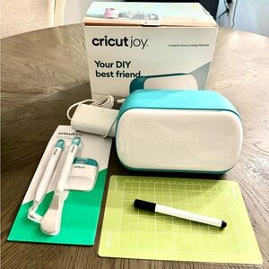 Cricut joy with accessories, box and starter tool set.